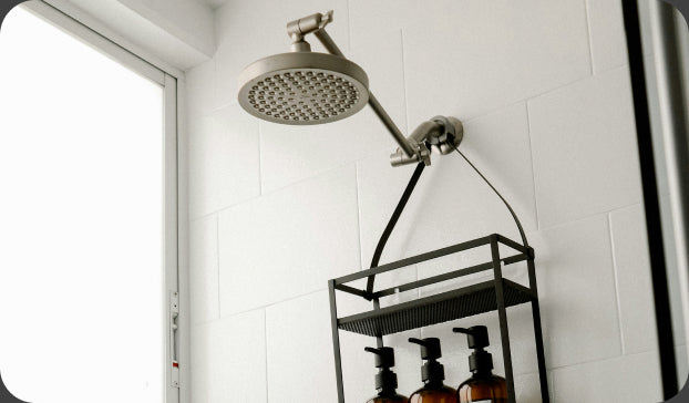 A walk-in shower with the water running
